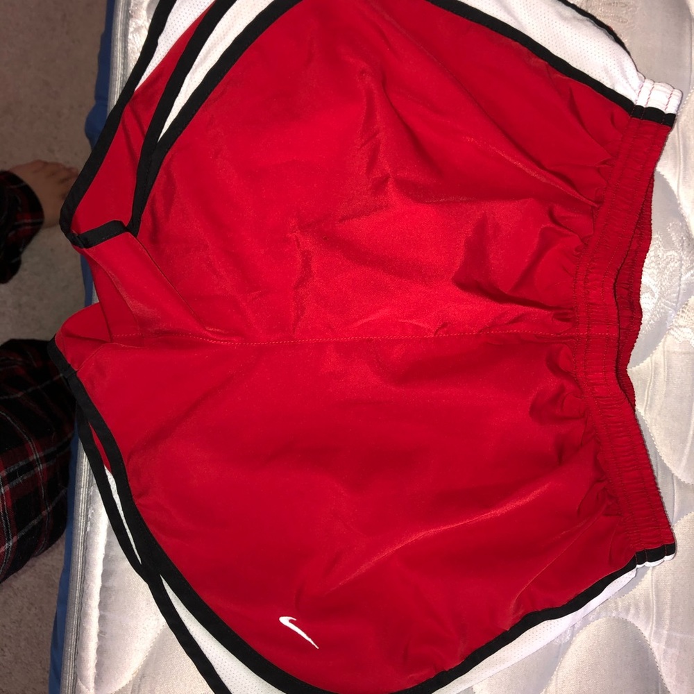 Red Nike shorts